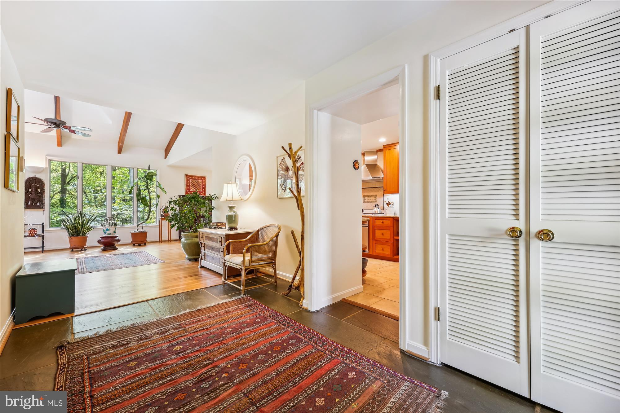10606 Mantz Road Silver Spring, MD 20903 - Photo 10 of 72 a living room with furniture floor to ceiling window and wooden floor