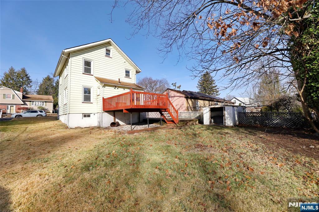 109 Luke Avenue Bergenfield, NJ 07621 - Photo 14 of 16 a front view of a house with a yard