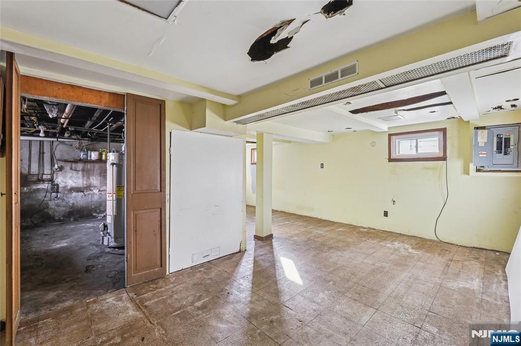 109 Luke Avenue Bergenfield, NJ 07621 - Photo 4 of 16 a view of a big room with wooden floor and windows