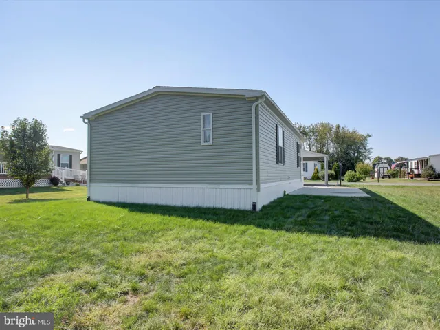 a front view of house with yard and seating