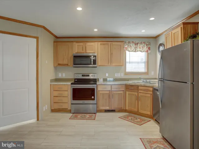 a kitchen with a refrigerator sink and microwave