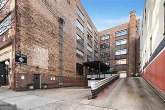 a view of a building with a bench in front of building