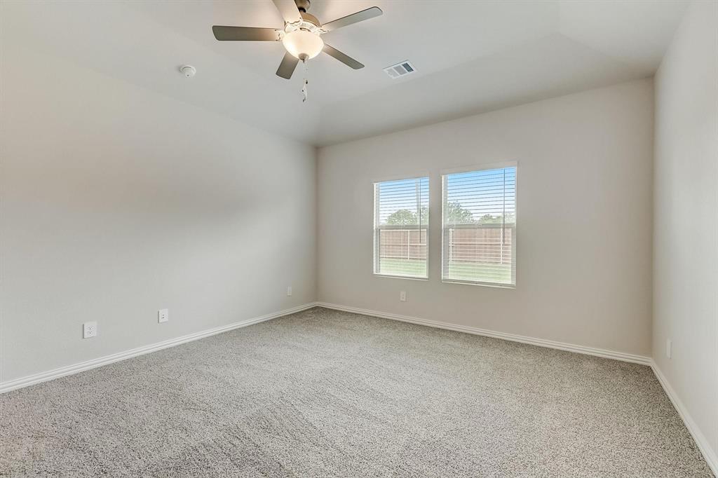 1405 Winters Way McKinney, TX 75071 - Photo 29 of 32 Carpeted empty room featuring ceiling fan