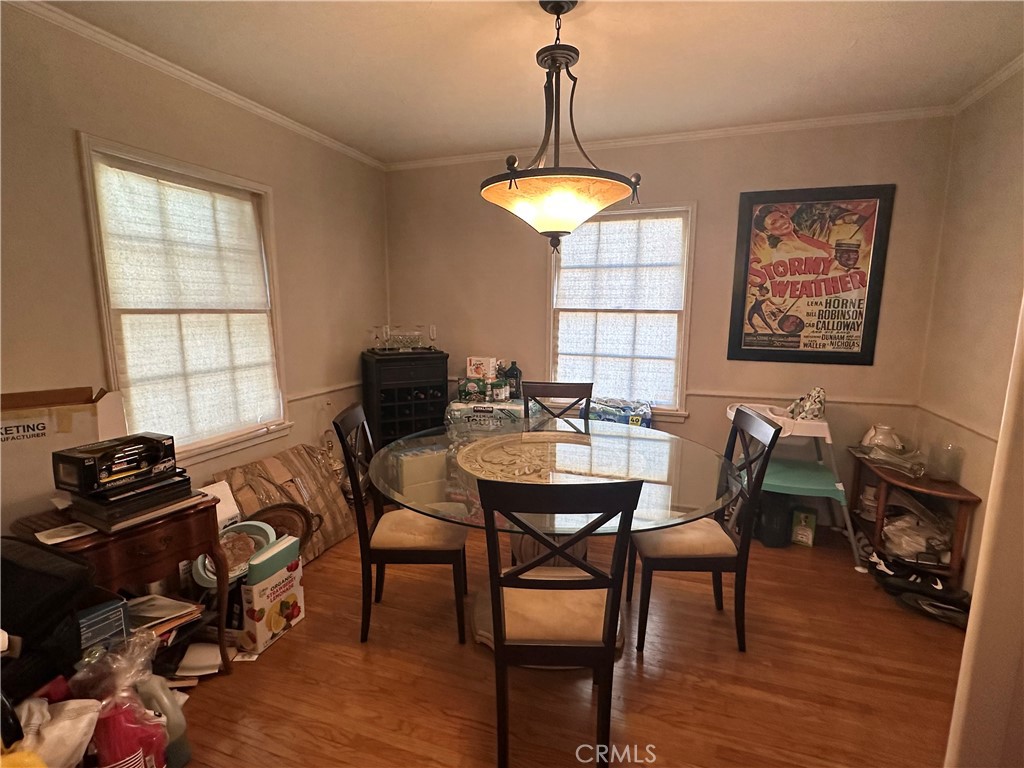 4056 Creed Avenue Los Angeles, CA 90008 - Photo 11 of 13 a view of a dining room with furniture and wooden floor