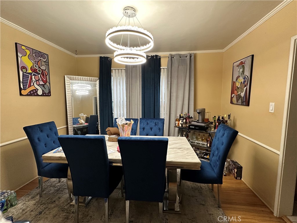 4056 Creed Avenue Los Angeles, CA 90008 - Photo 4 of 13 a view of a dining room with furniture and chandelier