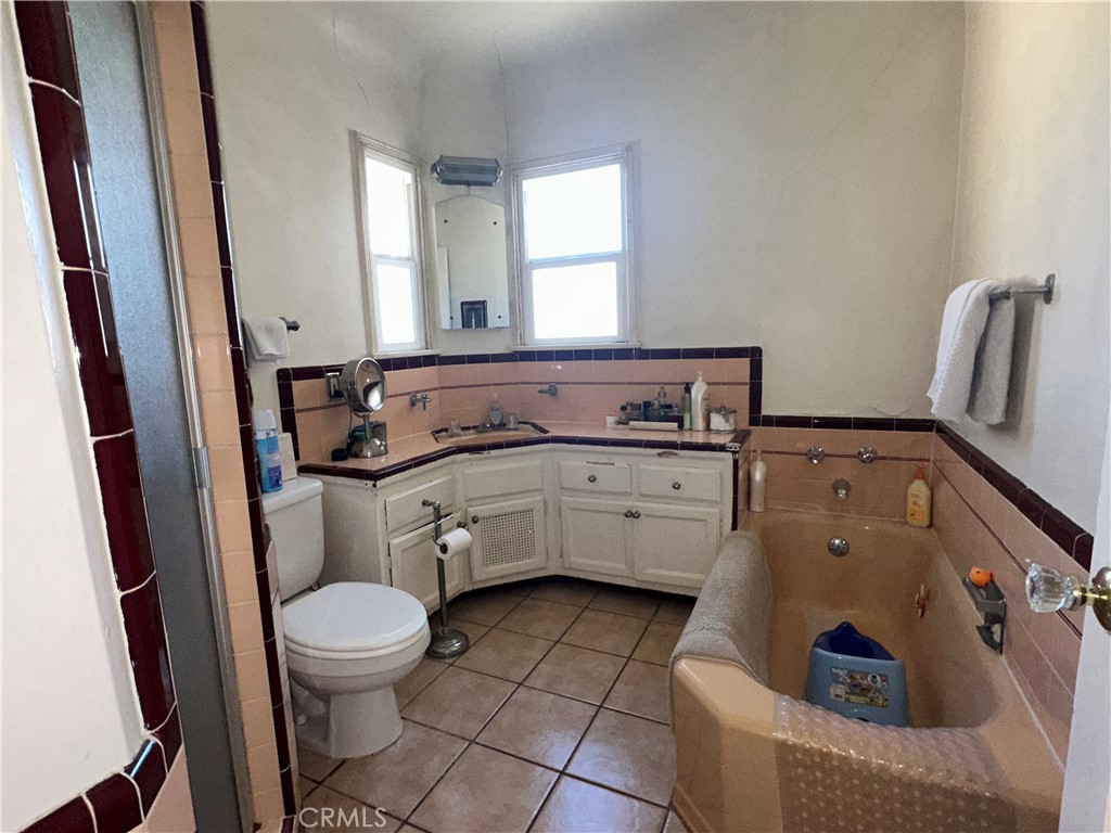 4056 Creed Avenue Los Angeles, CA 90008 - Photo 9 of 13 a bathroom with a toilet sink and mirror