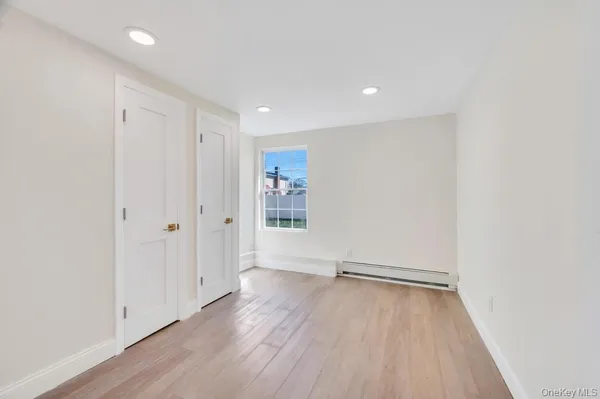 a view of wooden floor in an empty room