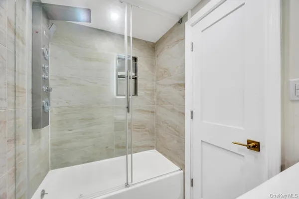 a bathroom with a shower and bathtub