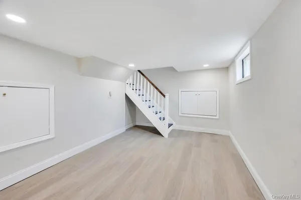 a view of an entryway with wooden floor