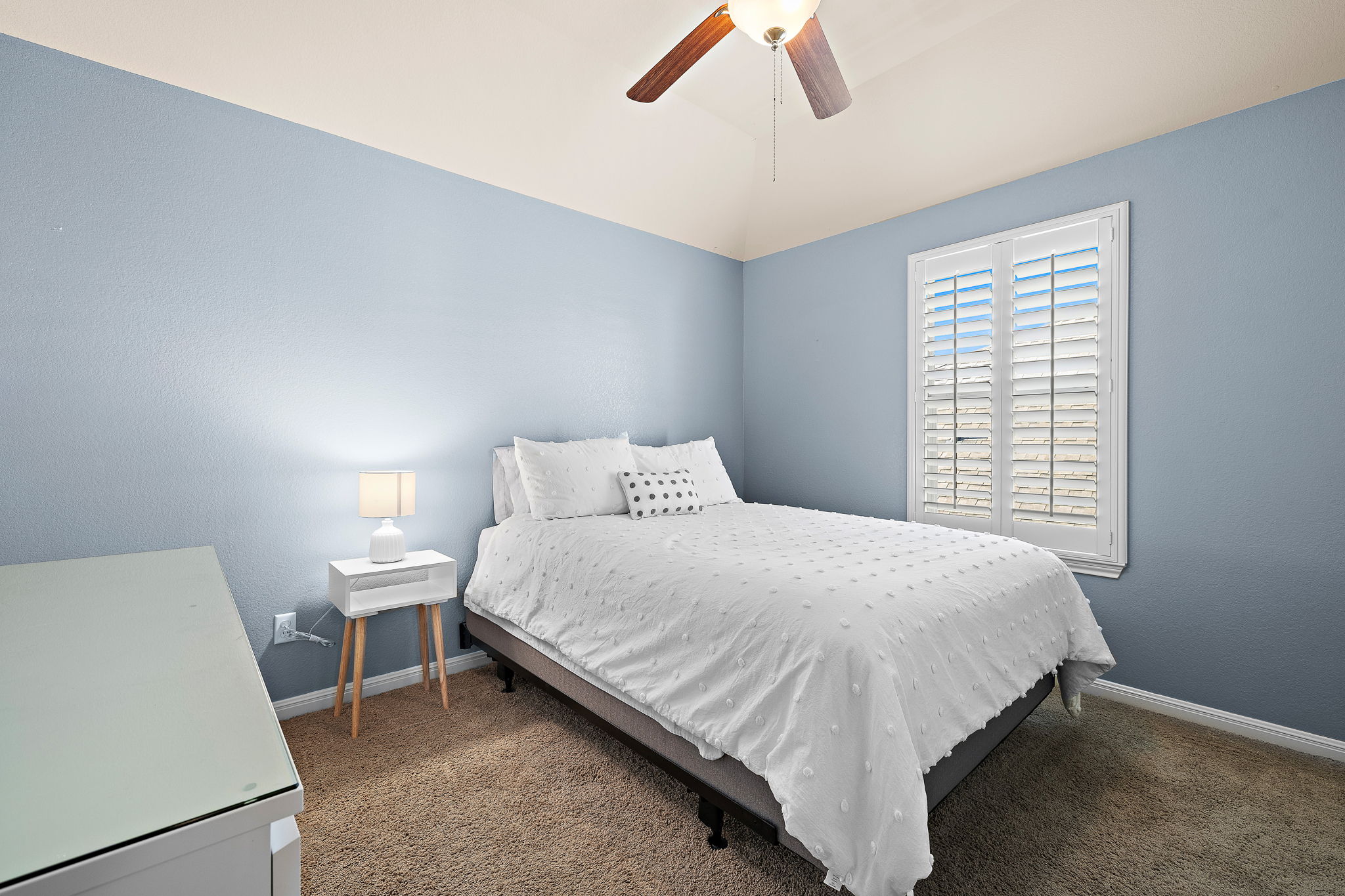 4413 Tambre Bend Austin, TX 78738 - Photo 24 of 30 Carpeted bedroom with lofted ceiling and ceiling fan