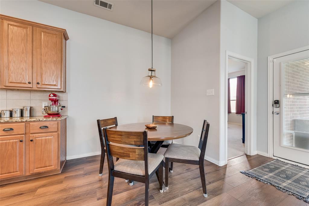 508 Elmgrove Trail Forney, TX 75126 - Photo 12 of 32 a dining room with furniture and wooden floor