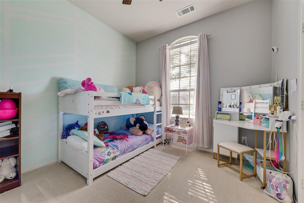 508 Elmgrove Trail Forney, TX 75126 - Photo 16 of 32 a bed room with a bed and a window