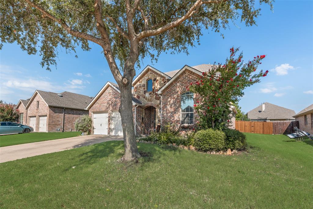 508 Elmgrove Trail Forney, TX 75126 - Photo 2 of 32 a front view of a house with garden