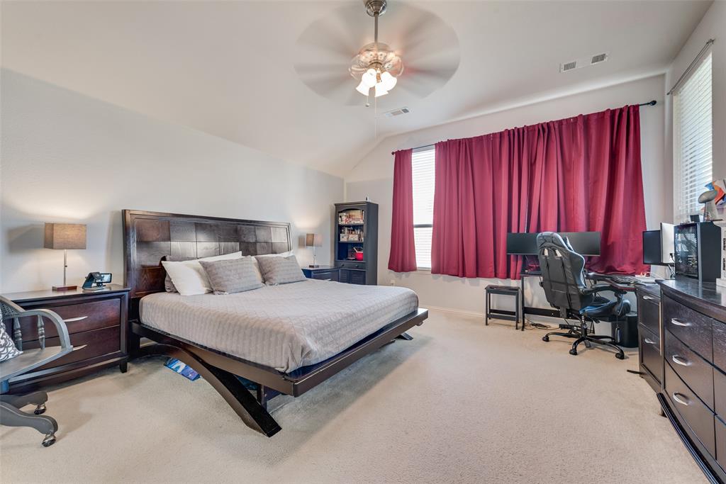 508 Elmgrove Trail Forney, TX 75126 - Photo 21 of 32 a bedroom with a bed and a furniture