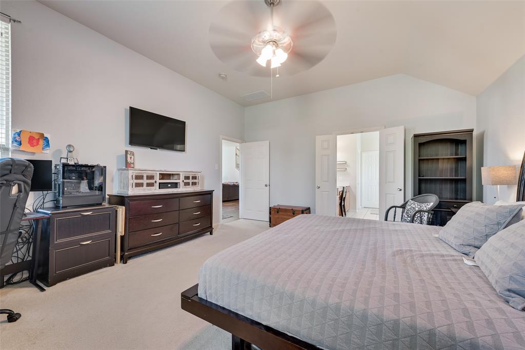 508 Elmgrove Trail Forney, TX 75126 - Photo 22 of 32 a bedroom with a bed and a television