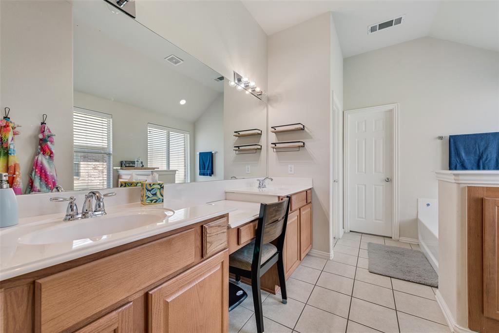 508 Elmgrove Trail Forney, TX 75126 - Photo 23 of 32 a kitchen with a sink and cabinets