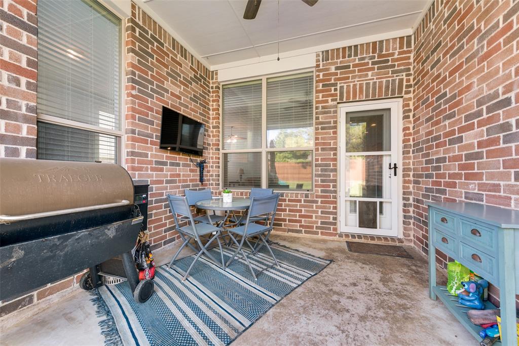 508 Elmgrove Trail Forney, TX 75126 - Photo 29 of 32 a balcony with furniture and a potted plant