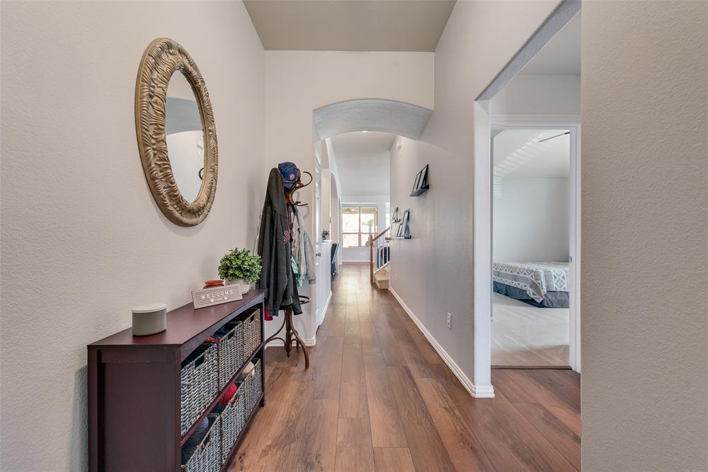 508 Elmgrove Trail Forney, TX 75126 - Photo 5 of 32 walk in closet with wooden floor and a mirror