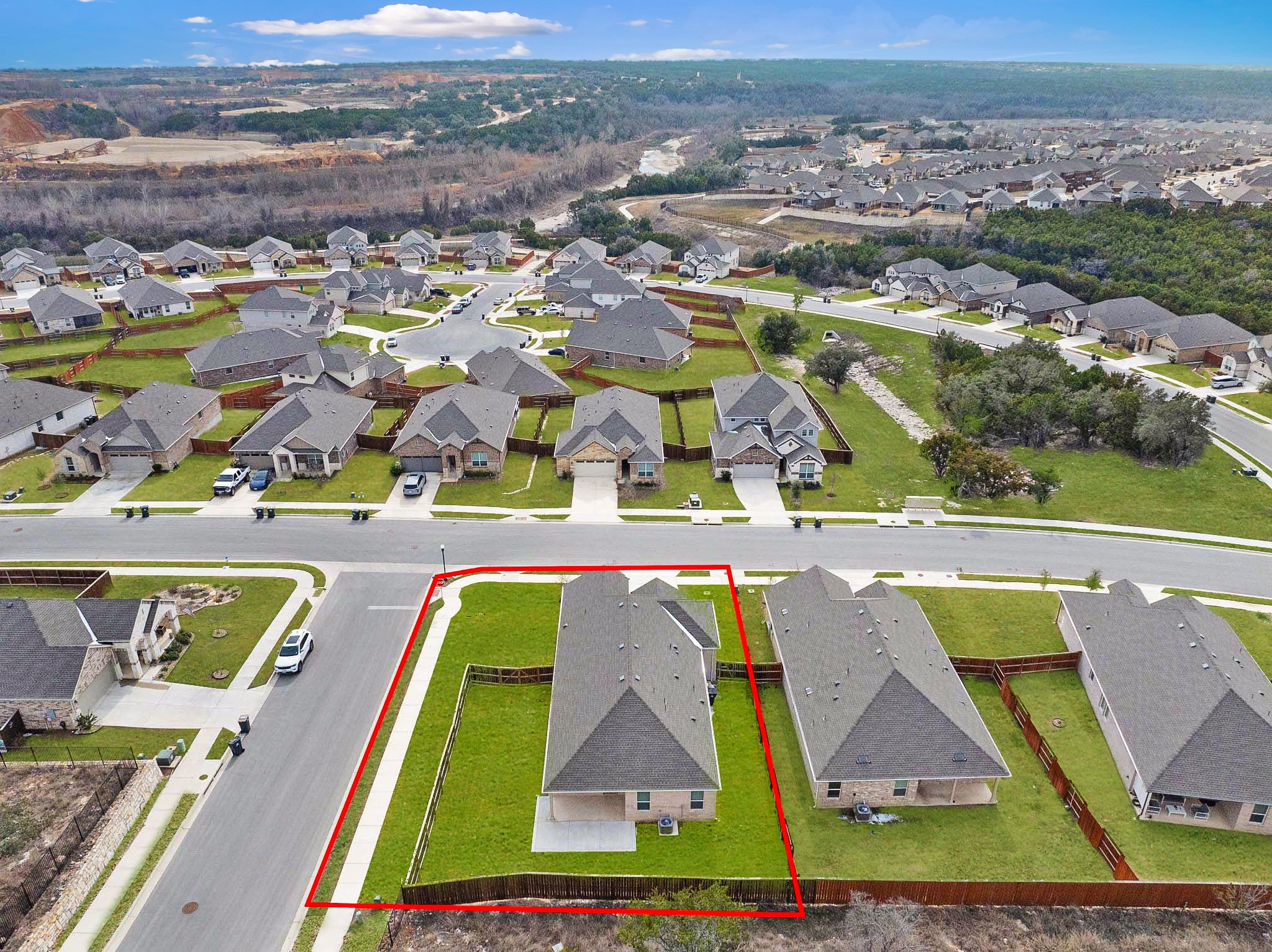 309 Barton Run Drive Georgetown, TX 78628 - Photo 28 of 35 Aerial perspective of suburban area with property parcel outlined