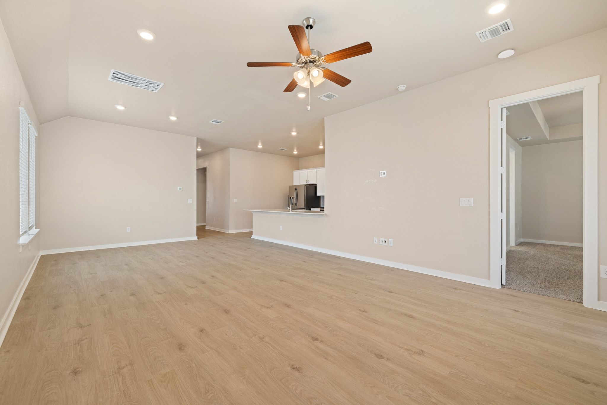 309 Barton Run Drive Georgetown, TX 78628 - Photo 7 of 35 Unfurnished living room with recessed lighting, ceiling fan, and light wood finished floors