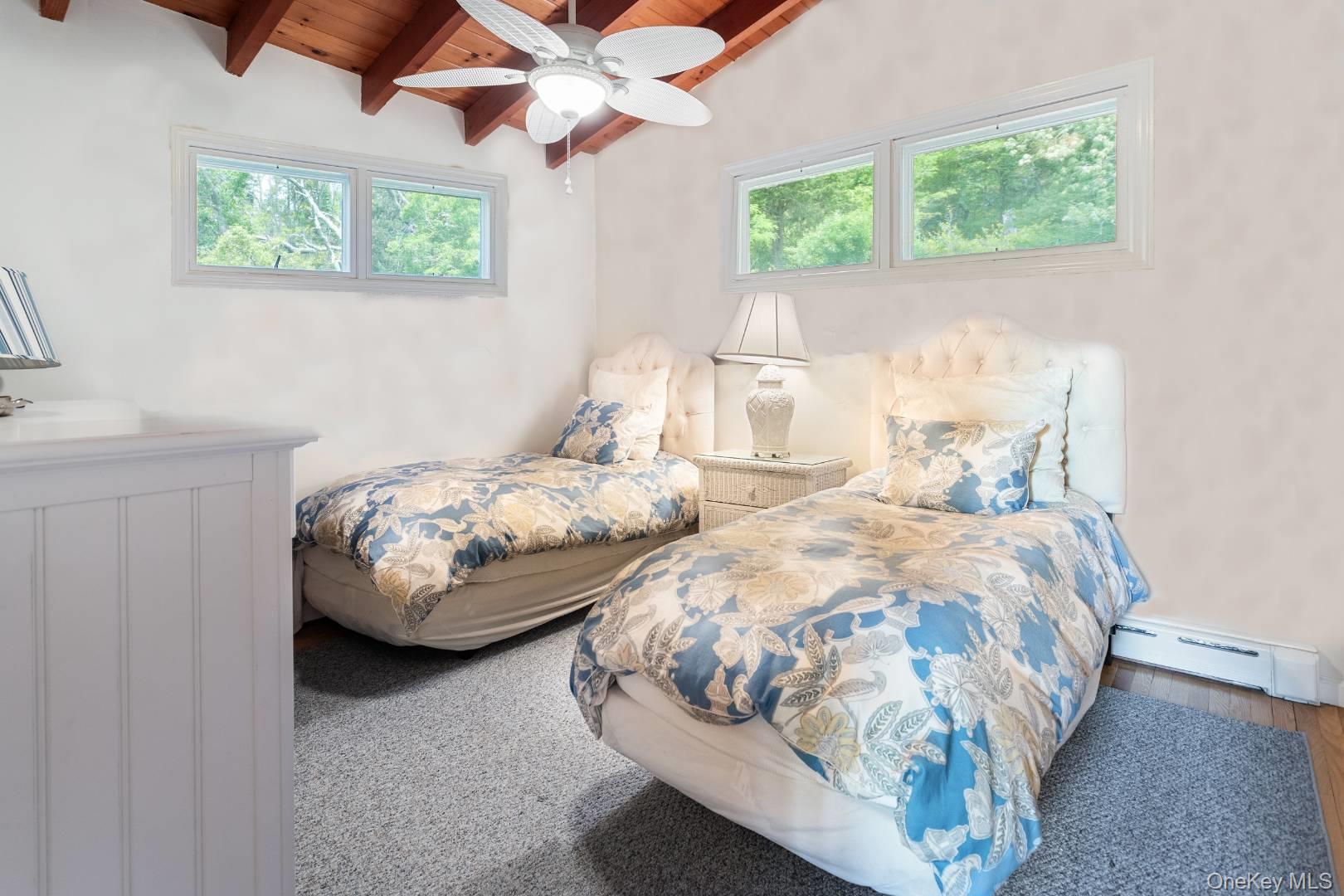 16 South Beach Road Southampton, NY 11968 - Photo 14 of 14 Bedroom featuring wood ceiling, baseboard heating, and ceiling fan