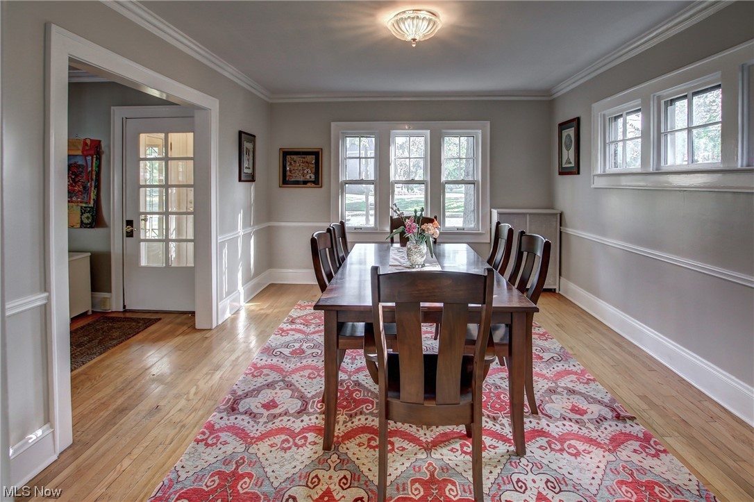 15911 Fernway Road Cleveland, OH 44120 - Photo 10 of 32 Wood floored dining area with ornamental molding