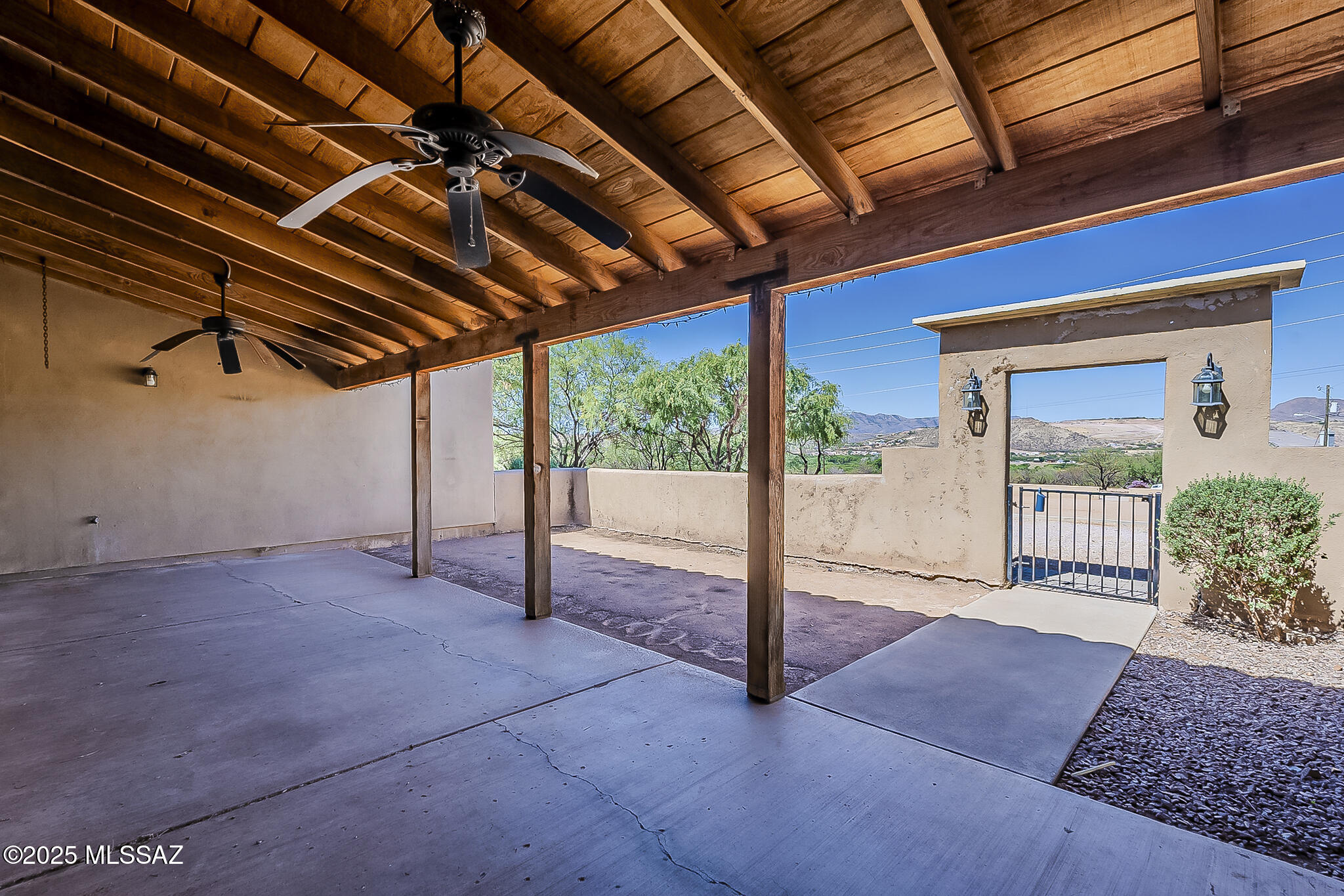 1503 Camino Bacalao Rio Rico, AZ 85648 - Photo 3 of 43 a view of porch with a table and chairs under an umbrella