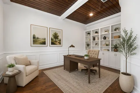 a workspace with furniture and window