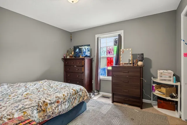 a bedroom with a bed and a closet