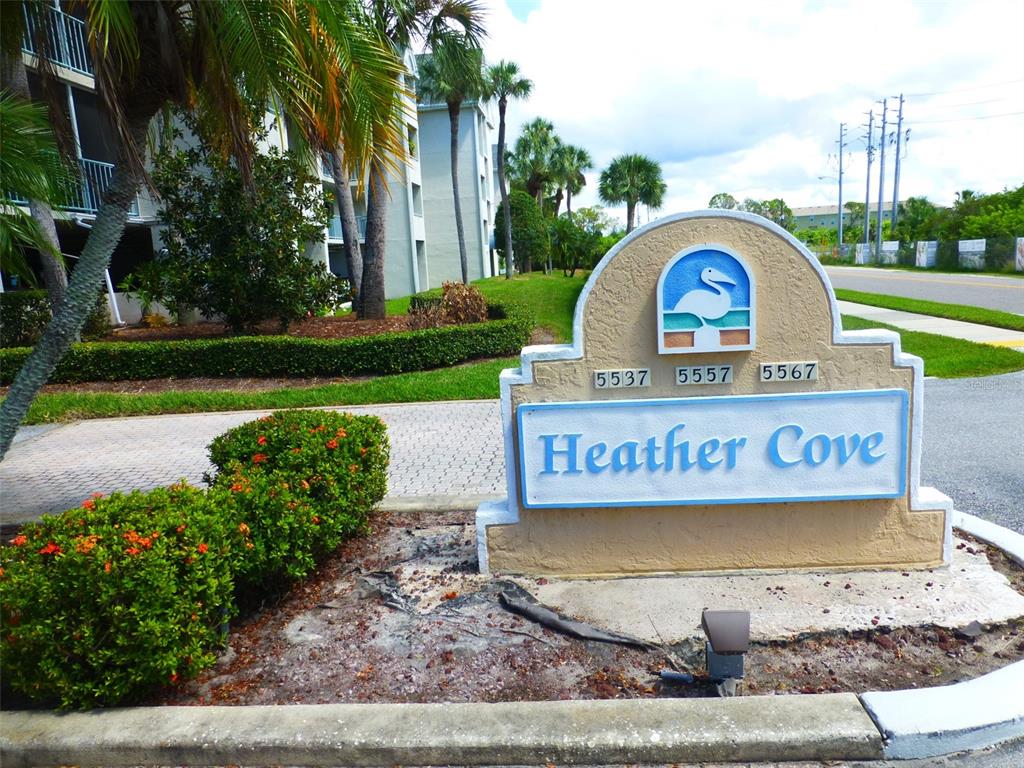 a view of a park with a sign board