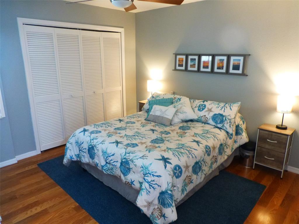 5557 Sea Forest Drive, Unit 215 New Port Richey, FL 34652 - Photo 17 of 40 a bedroom with a bed and a window