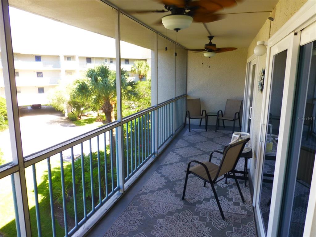 5557 Sea Forest Drive, Unit 215 New Port Richey, FL 34652 - Photo 21 of 40 a view of a room with furniture and a window