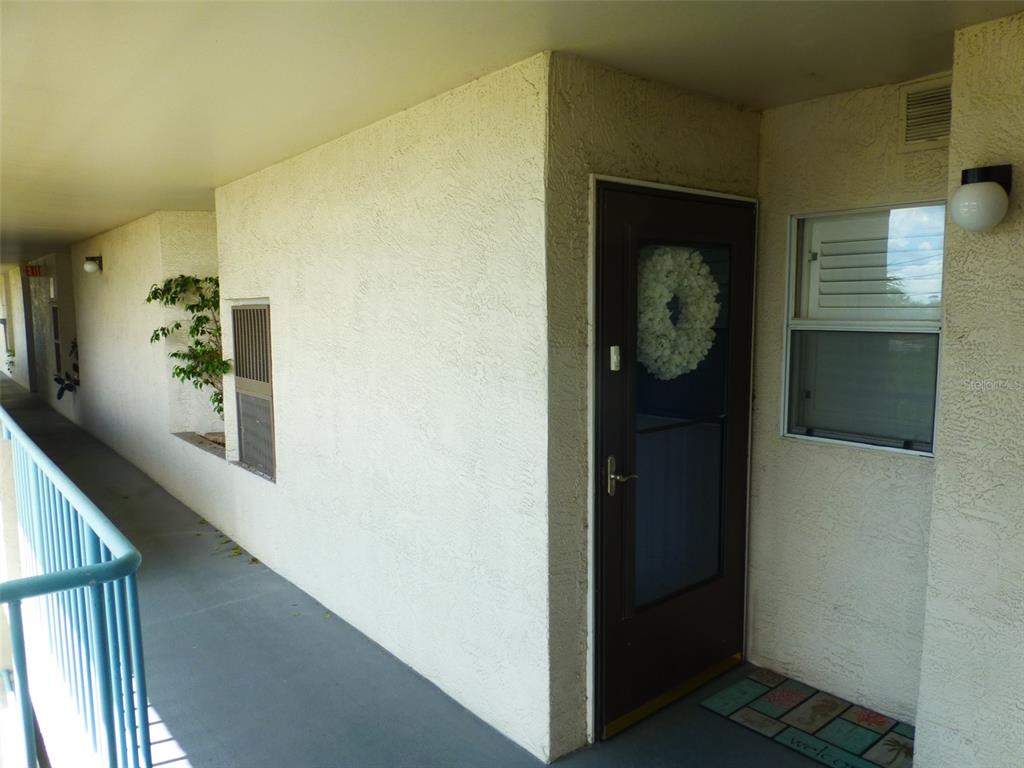 5557 Sea Forest Drive, Unit 215 New Port Richey, FL 34652 - Photo 3 of 40 a view of elevator with hallway