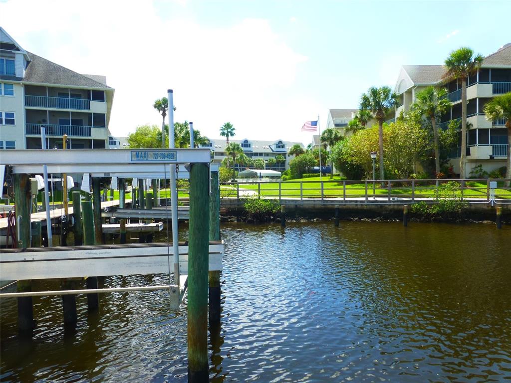 5557 Sea Forest Drive, Unit 215 New Port Richey, FL 34652 - Photo 33 of 40 a view of swimming pool with outdoor seating and yard
