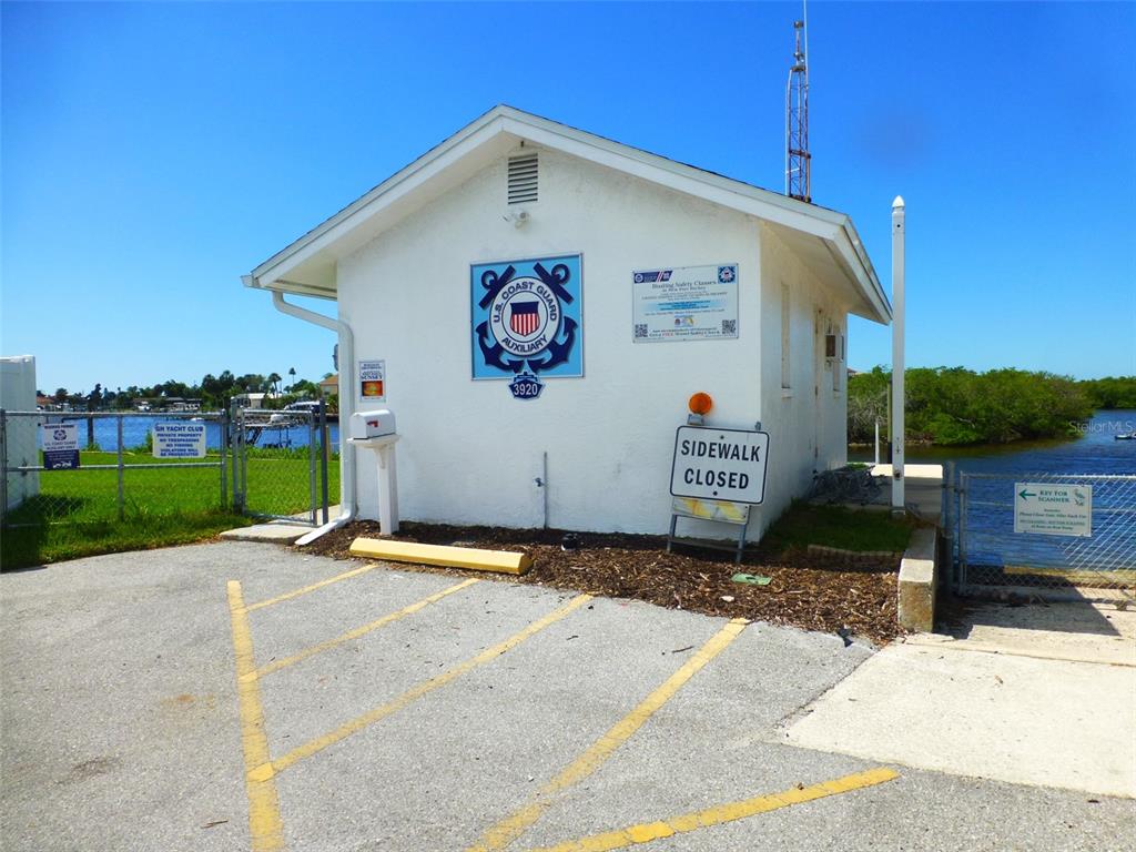 5557 Sea Forest Drive, Unit 215 New Port Richey, FL 34652 - Photo 37 of 40 a sign on the side of a road