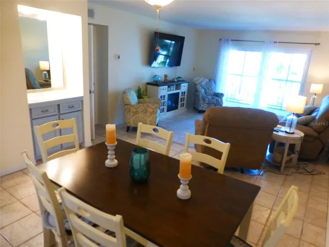 a living room with dining table