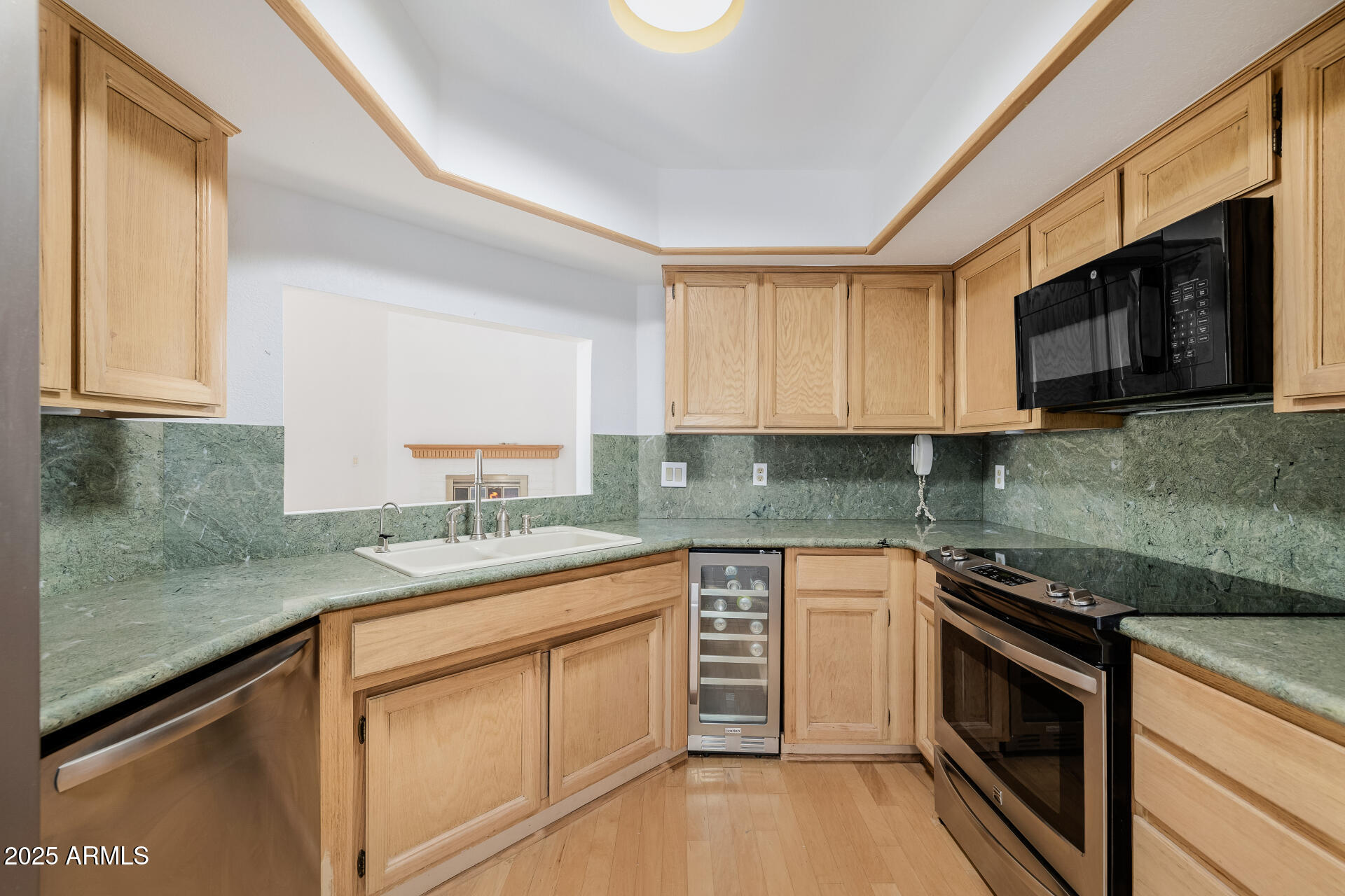 1875 East State Avenue Phoenix, AZ 85020 - Photo 11 of 39 a kitchen with stainless steel appliances granite countertop a sink stove and microwave