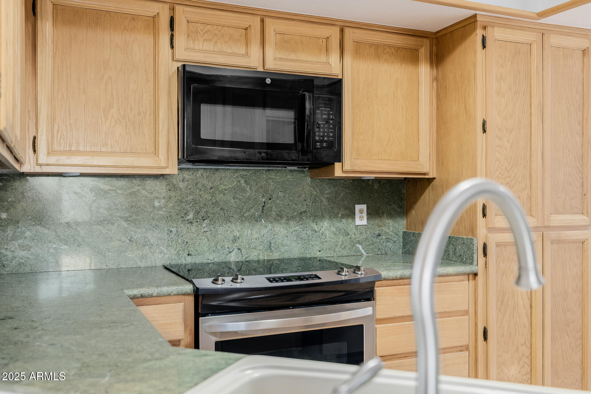 1875 East State Avenue Phoenix, AZ 85020 - Photo 14 of 39 a kitchen with a stove and a microwave