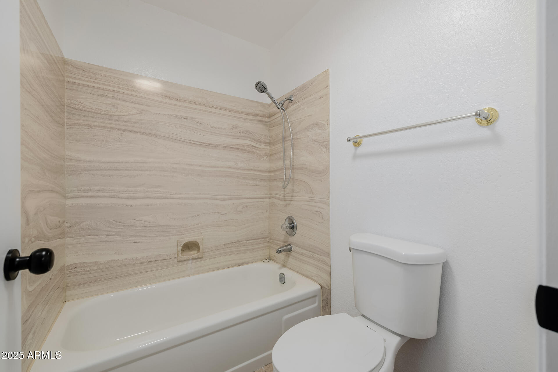 1875 East State Avenue Phoenix, AZ 85020 - Photo 27 of 39 a bathroom with a toilet and a bathtub