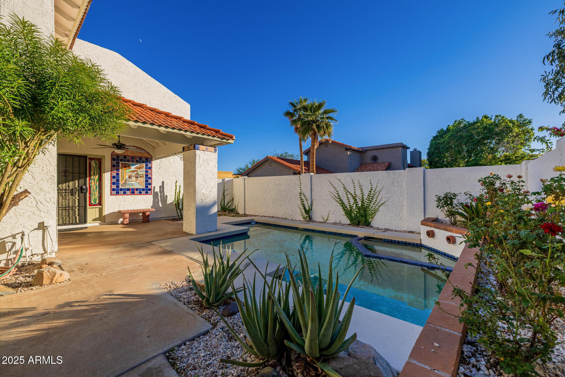 1875 East State Avenue Phoenix, AZ 85020 - Photo 32 of 39 a view of a patio with table and chairs potted plants with wooden fence