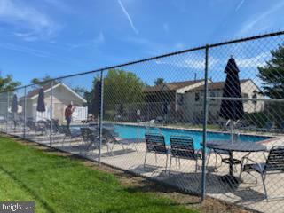 27 Pickwick Place Sewell, NJ 08080 - Photo 18 of 18 a patio with glass top table and chairs