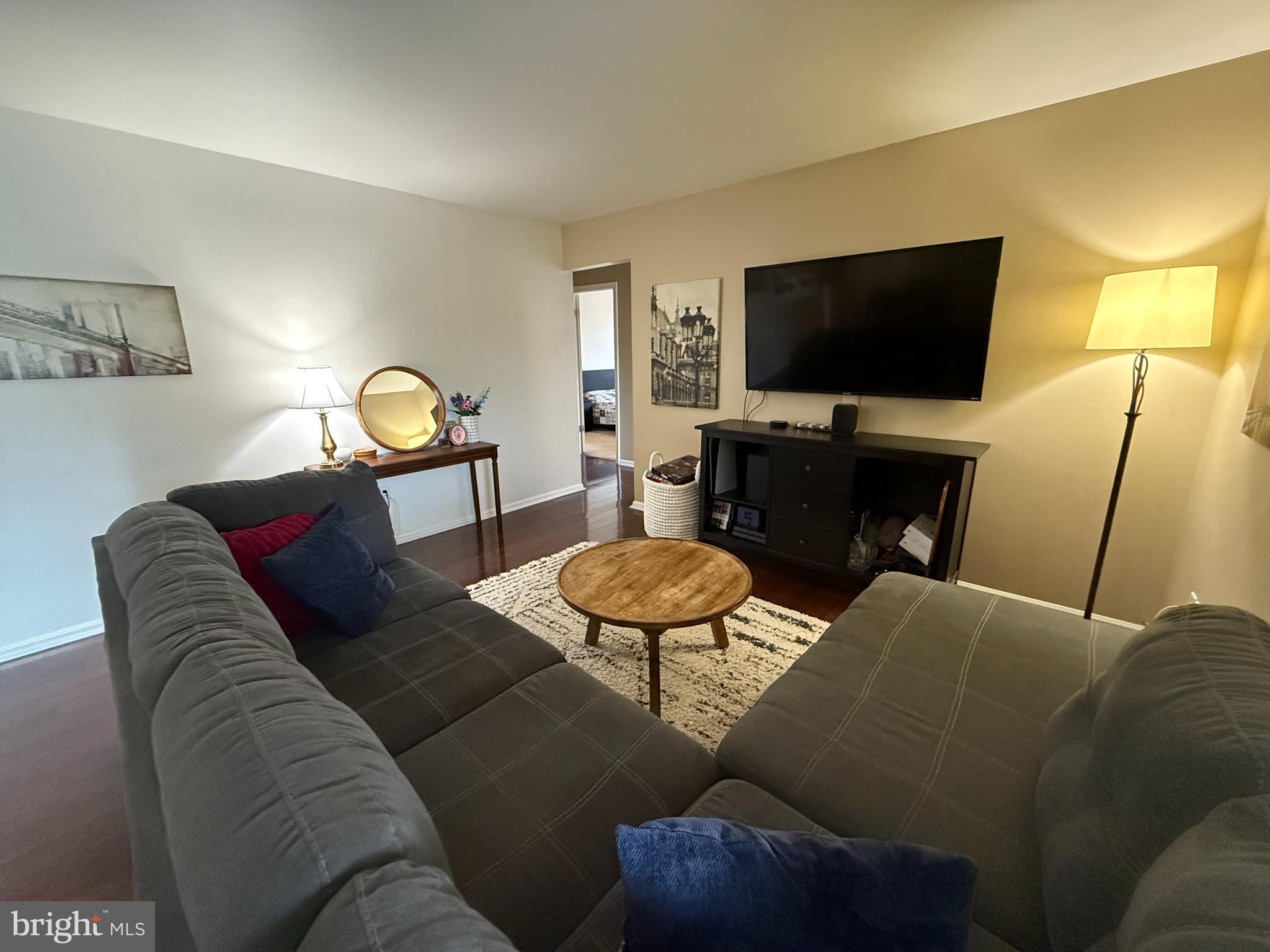 27 Pickwick Place Sewell, NJ 08080 - Photo 4 of 18 a living room with furniture and a flat screen tv