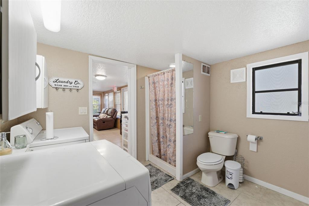3290 Seaview Drive Spring Hill, FL 34606 - Photo 17 of 31 a spacious bathroom with a toilet sink and shower