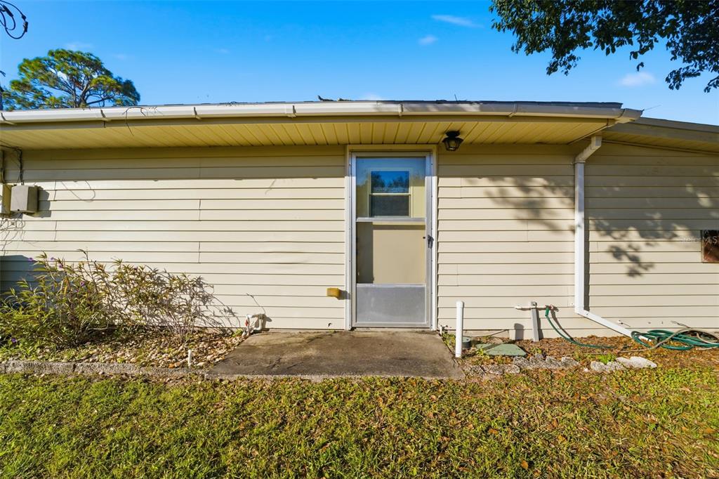 3290 Seaview Drive Spring Hill, FL 34606 - Photo 29 of 31 a view of a house with a backyard