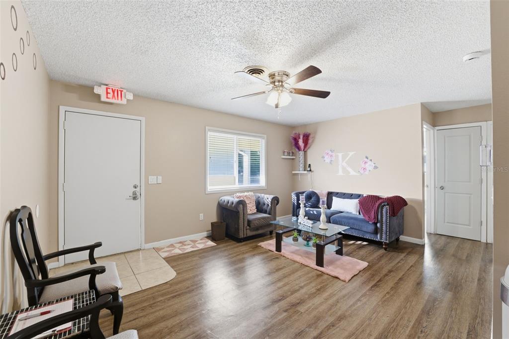 3290 Seaview Drive Spring Hill, FL 34606 - Photo 8 of 31 a living room with furniture and a wooden floor