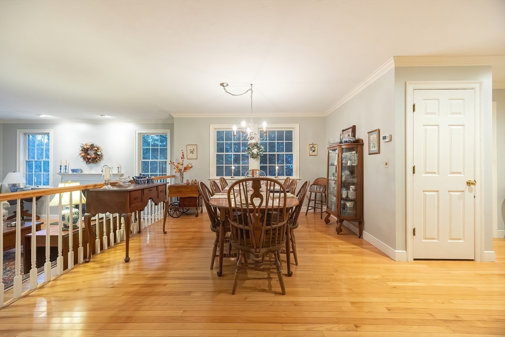 12 Highcroft Way, Unit 12 Hopkinton, MA 01748 - Photo 18 of 37 a dining room with furniture window and wooden floor