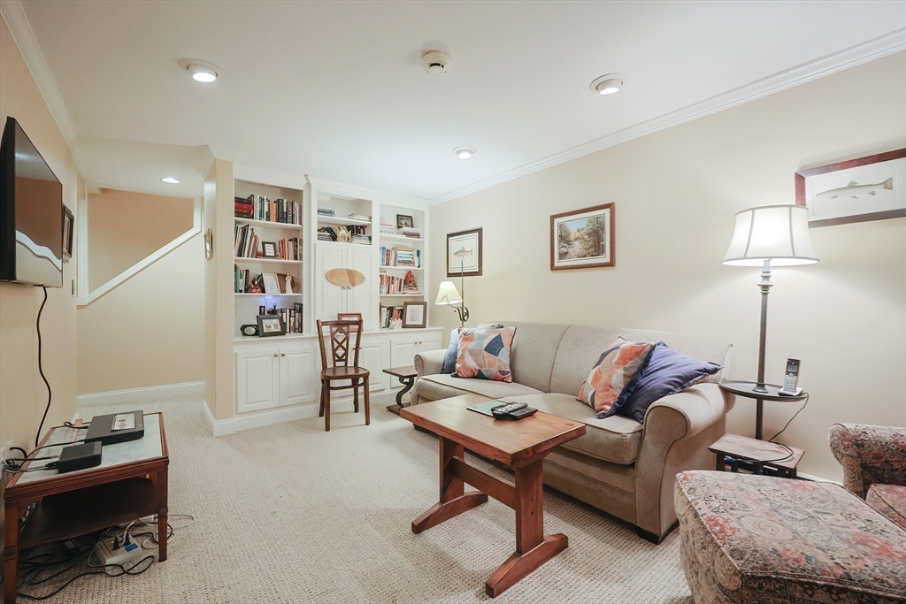 12 Highcroft Way, Unit 12 Hopkinton, MA 01748 - Photo 31 of 37 a living room with furniture and a couch