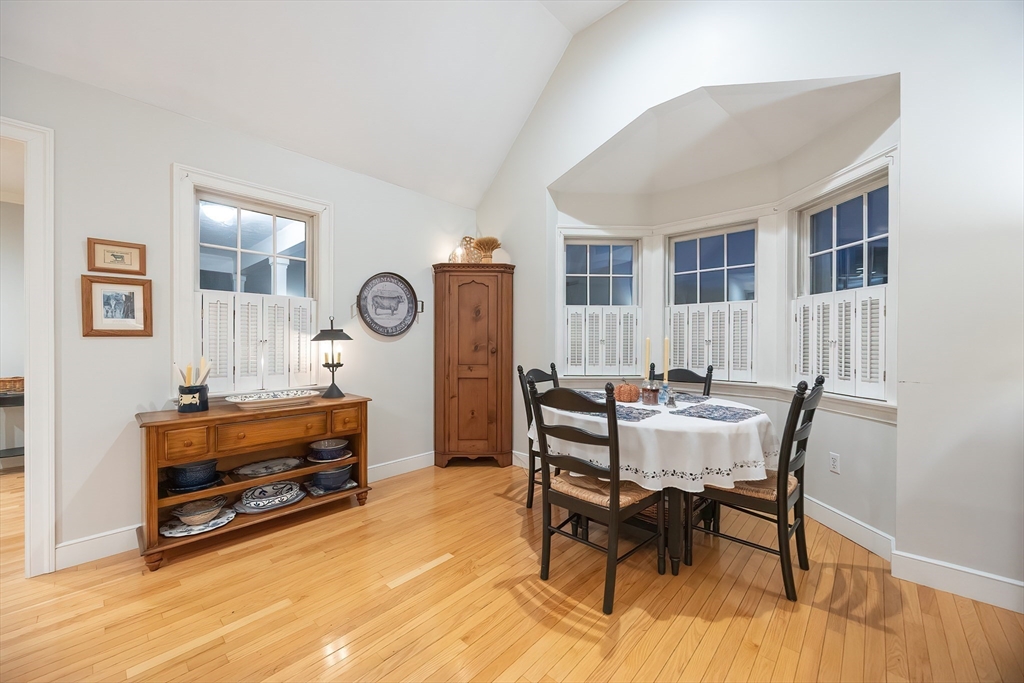 12 Highcroft Way, Unit 12 Hopkinton, MA 01748 - Photo 9 of 37 a view of a livingroom with furniture and a dining table