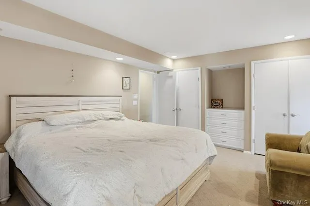 a large white bed in a white room