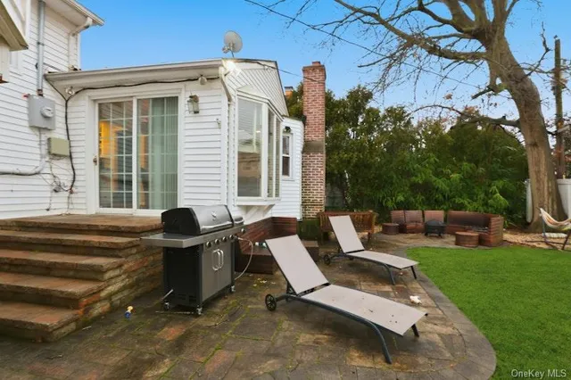 a view of backyard with outdoor seating
